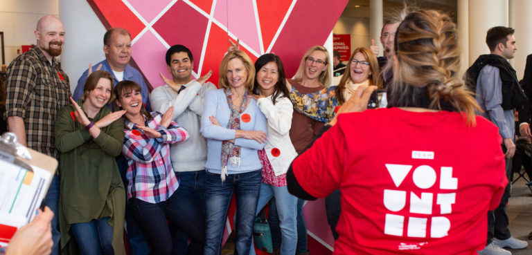 A group of TEDxMileHigh volunteers pose for a photo. Learn about TED volunteering.